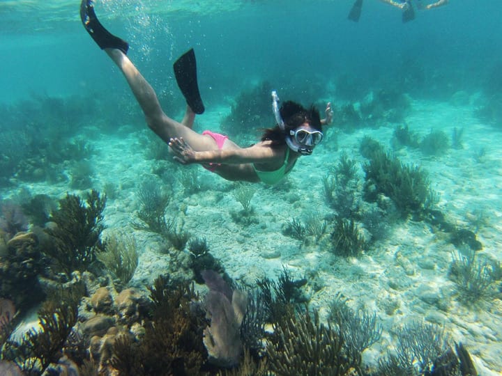 girl snorkeling belize