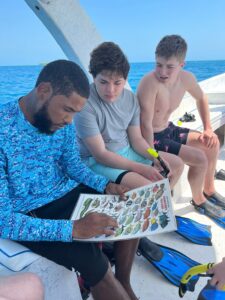 guide and boys family snorkeling trip family adventure