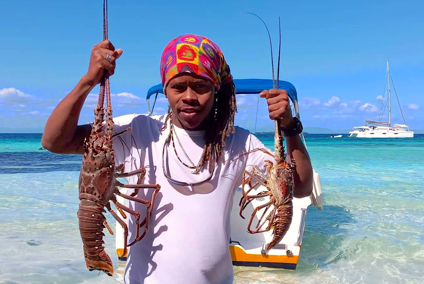 guide with lobsters in hand