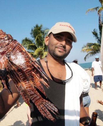 Tour company owner conrad Tour company owner conrad holding a lionfish